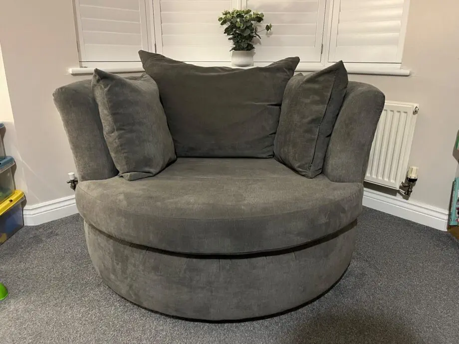 DFS 'Marquee' swivel chair, with original 'graphite' grey cushions