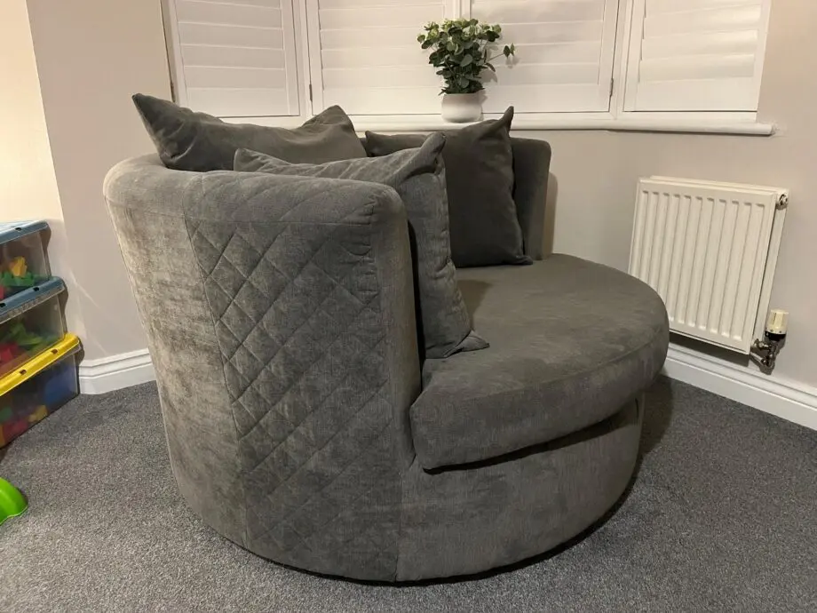 DFS 'Marquee' swivel chair, with original 'graphite' grey cushions