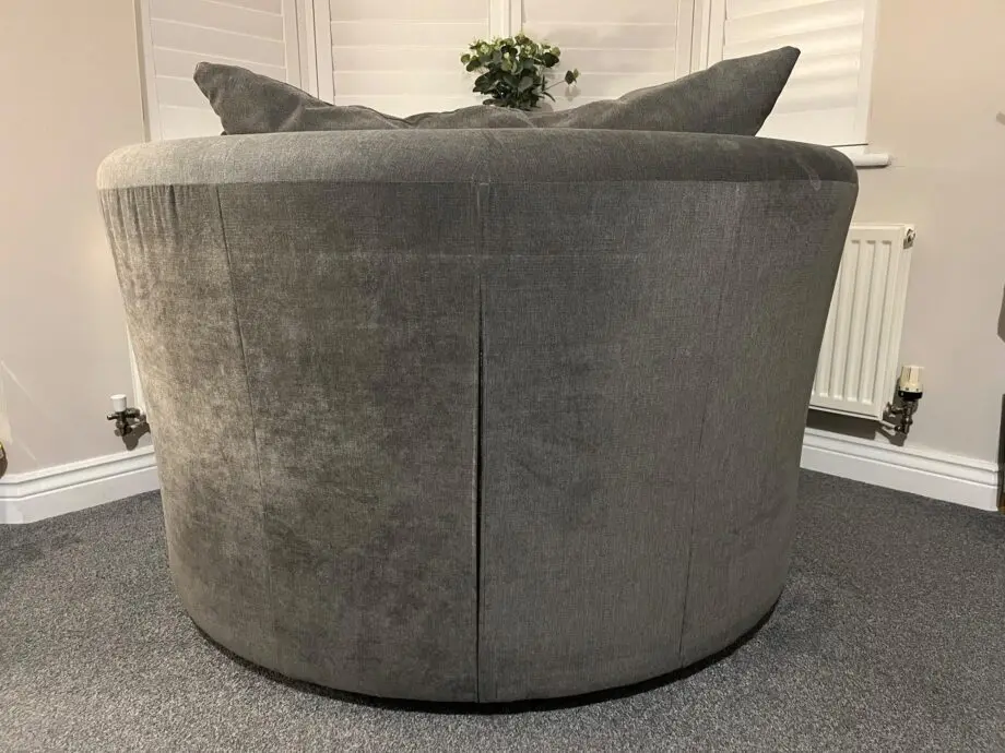DFS 'Marquee' swivel chair, with original 'graphite' grey cushions