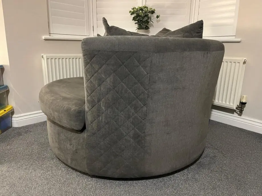 DFS 'Marquee' swivel chair, with original 'graphite' grey cushions