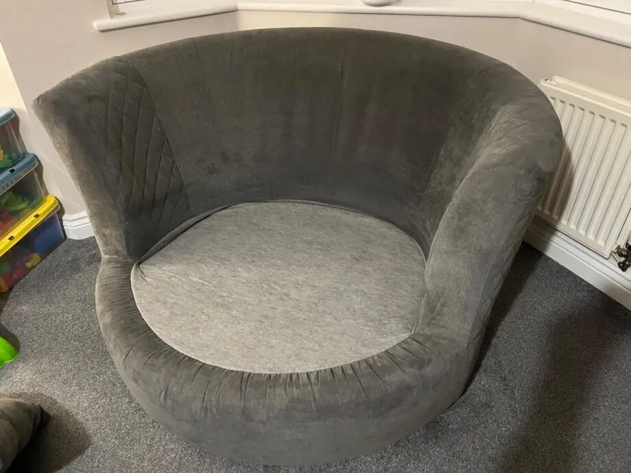 DFS 'Marquee' swivel chair, with original 'graphite' grey cushions