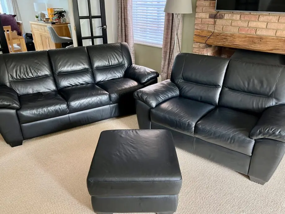 DFS Black Leather 3 and 2 Seater Sofas with matching footstool