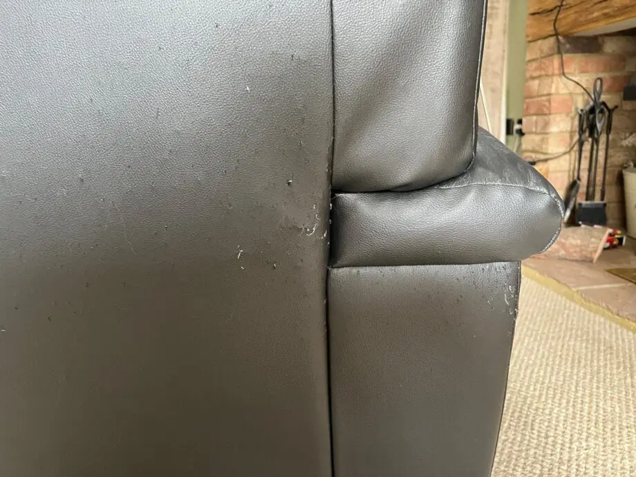 DFS Black Leather 3 and 2 Seater Sofas with matching footstool
