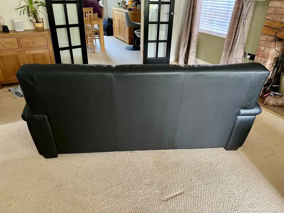 DFS Black Leather 3 and 2 Seater Sofas with matching footstool