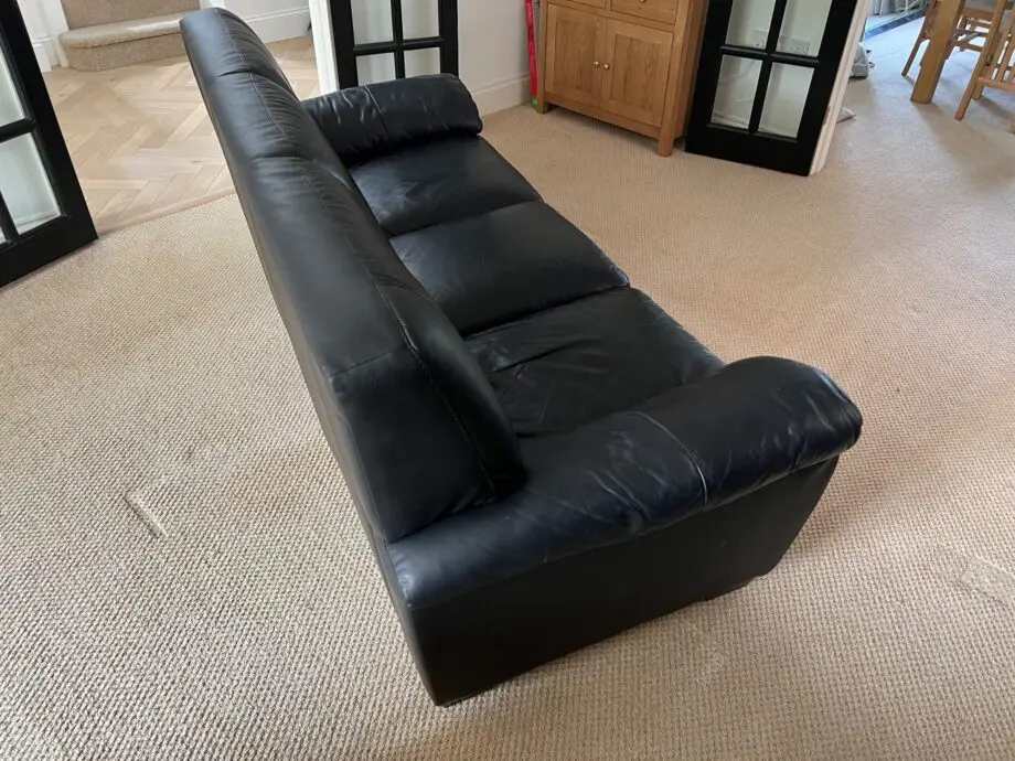 DFS Black Leather 3 and 2 Seater Sofas with matching footstool
