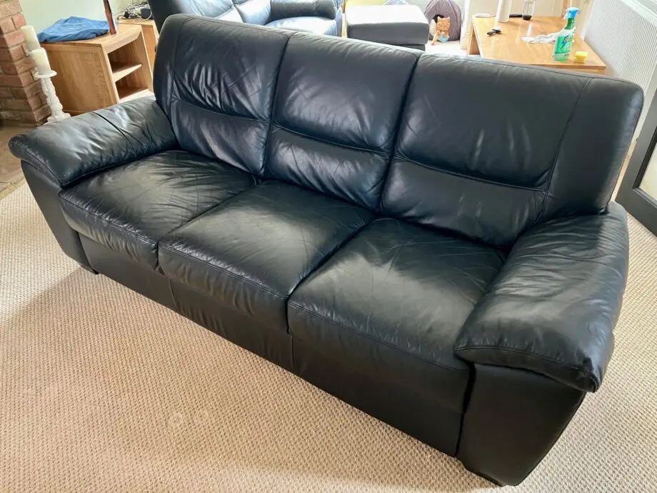 DFS Black Leather 3 and 2 Seater Sofas with matching footstool