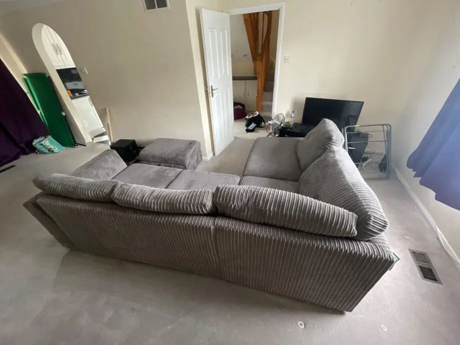DFS Grey Cord Corner Sofa and Matching Footstool