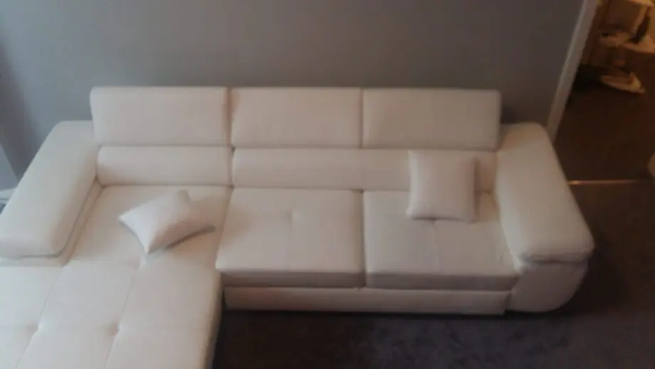 White leather corner sofa bed