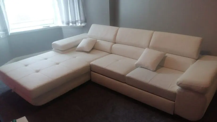 White leather corner sofa bed