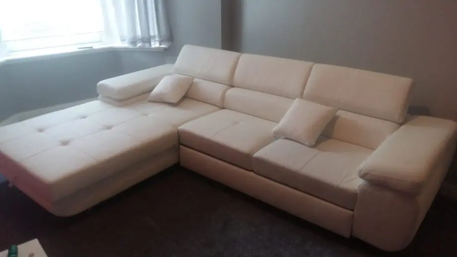 White leather corner sofa bed
