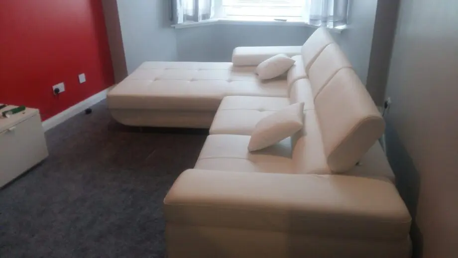 White leather corner sofa bed
