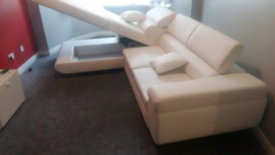 White leather corner sofa bed
