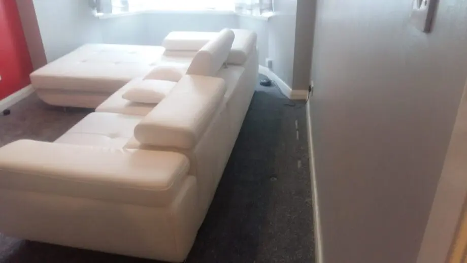 White leather corner sofa bed