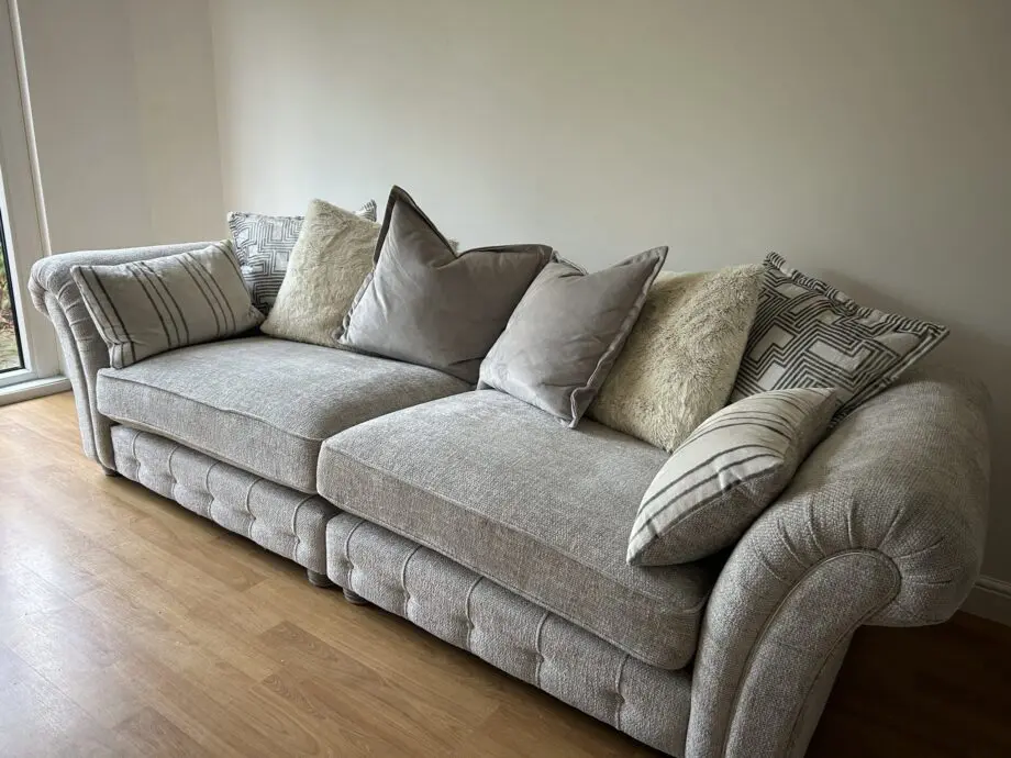 Furniture village three piece suite. Four seater, two seater snuggler & ottoman