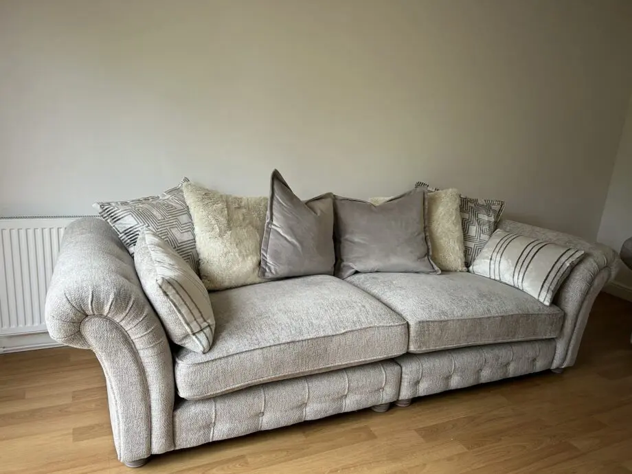 Furniture village three piece suite. Four seater, two seater snuggler & ottoman