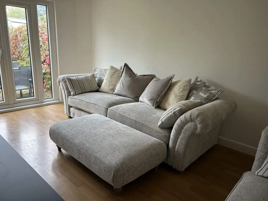 Furniture village three piece suite. Four seater, two seater snuggler & ottoman