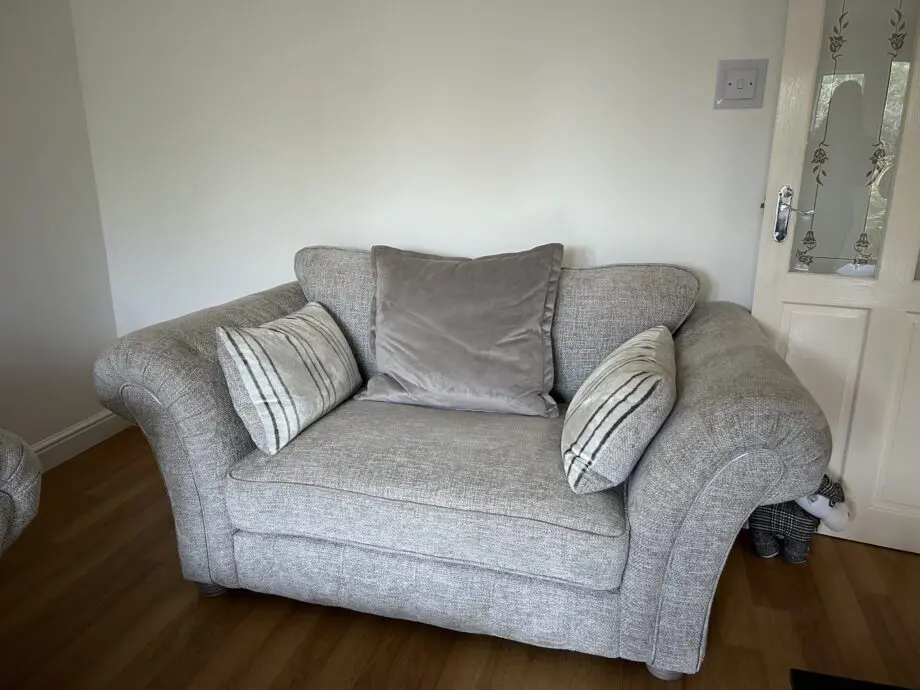 Furniture village three piece suite. Four seater, two seater snuggler & ottoman