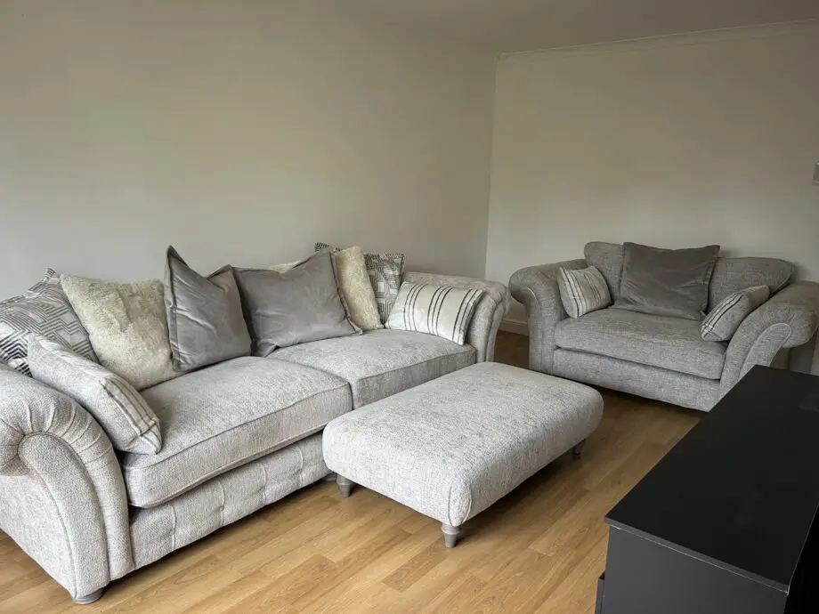 Furniture village three piece suite. Four seater, two seater snuggler & ottoman