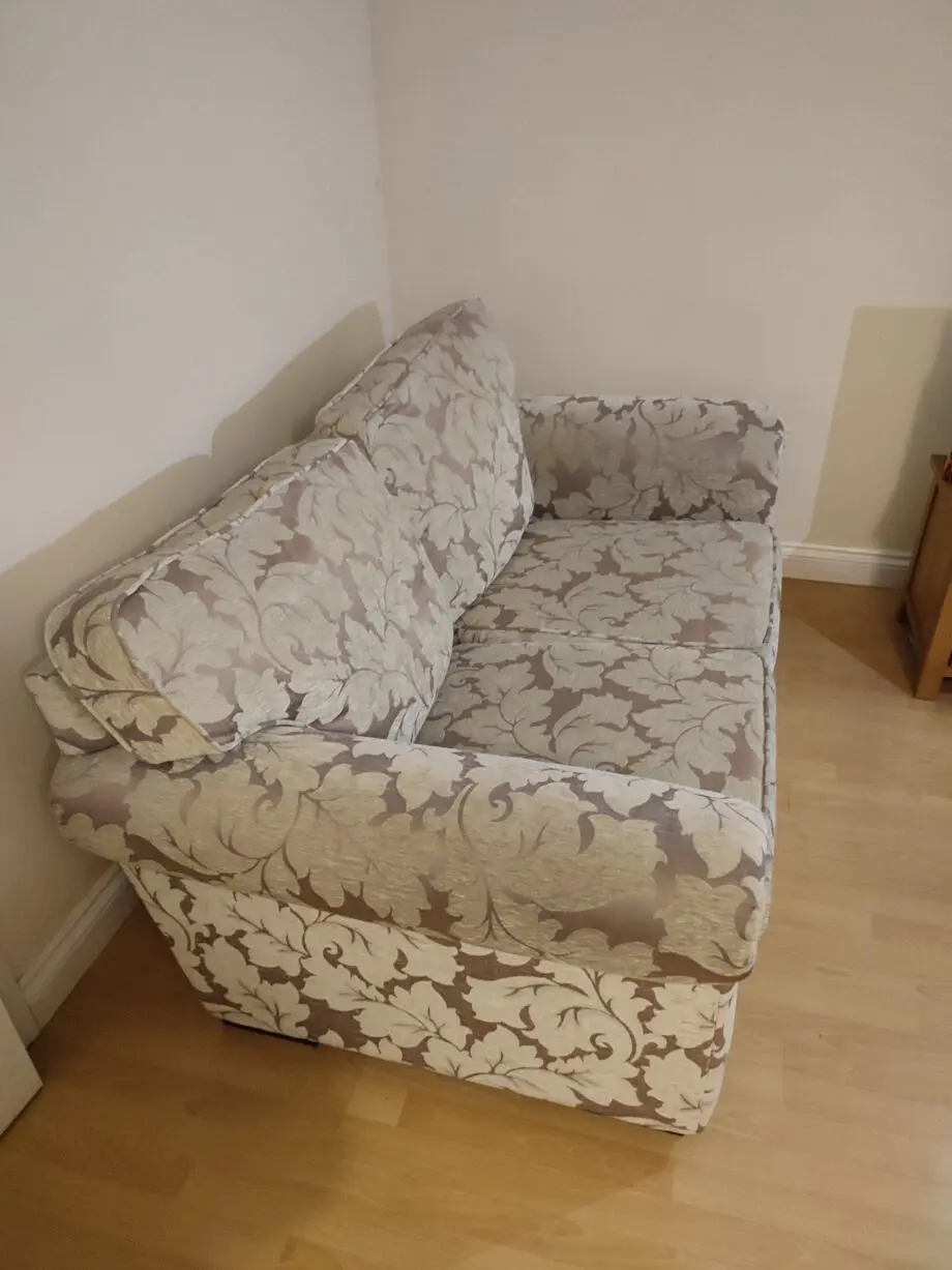 Beige and cream patterned sofa