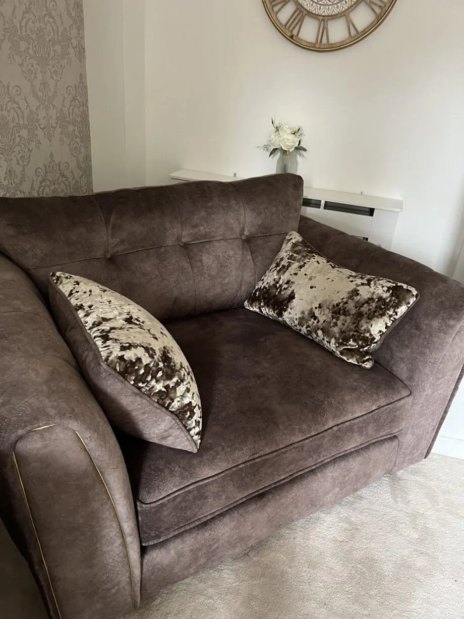 Two Seater Snuggler & footstool - Furniture Village - Ariana - Dapple Chocolate with brass insert