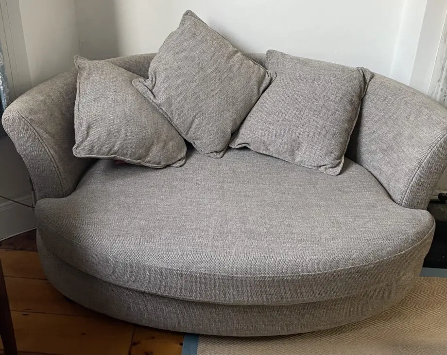 DFS beige boat shaped sofa, perfect for cosy evenings in front of the telly. Good as new.