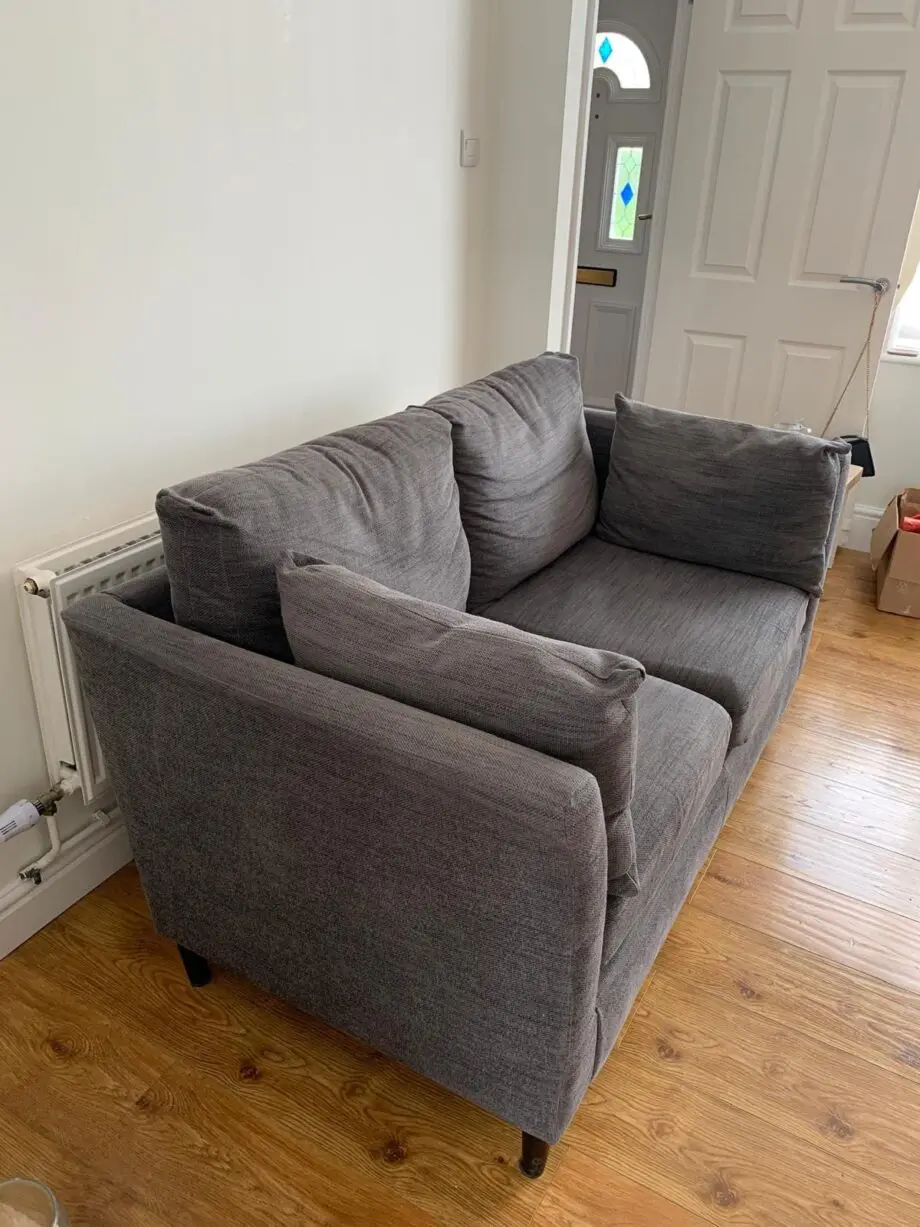 Grey IKEA sofa, armchair, and footstool