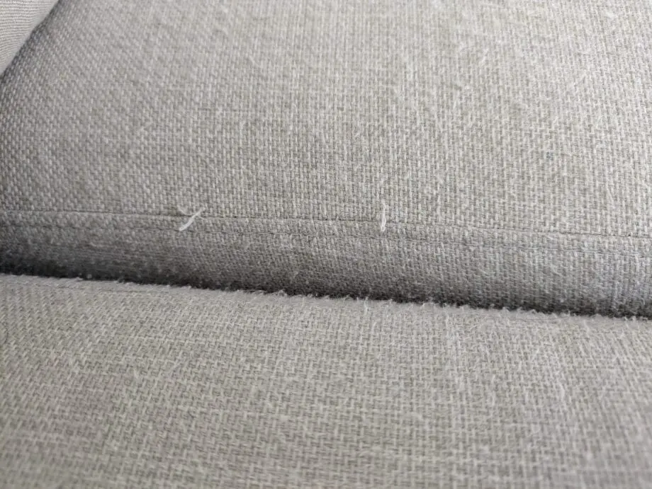 DFS corner sofa with scatter cushions, light grey and neutral cushions which are ikea