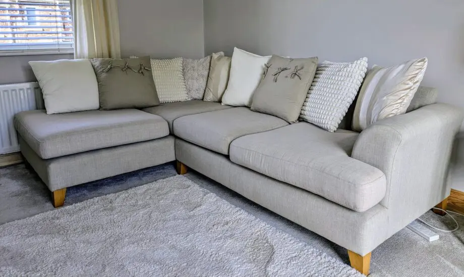 DFS corner sofa with scatter cushions, light grey and neutral cushions which are ikea