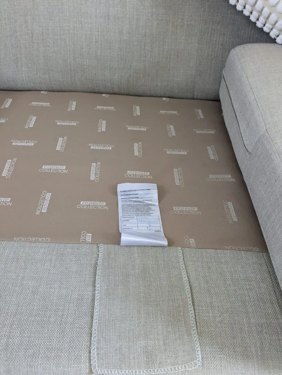 DFS corner sofa with scatter cushions, light grey and neutral cushions which are ikea