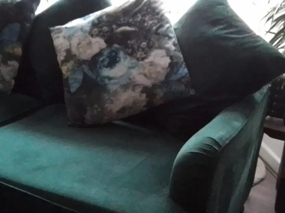 Large three seater forest green velvet sofa