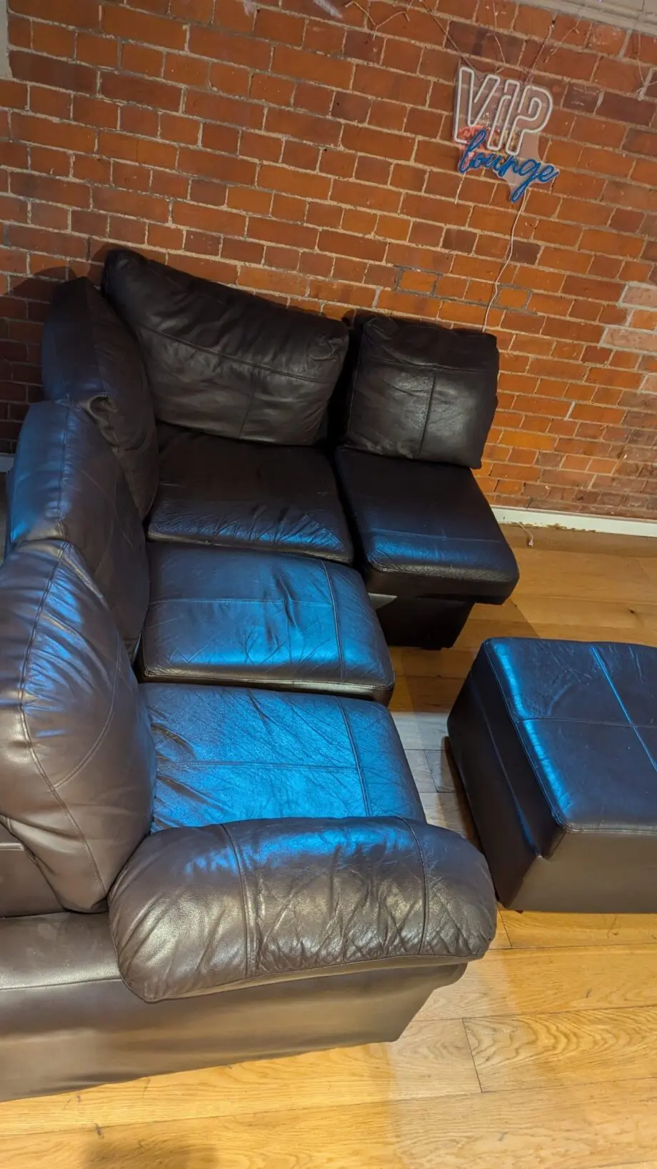 Small L-shaped brown leatherette sofa
