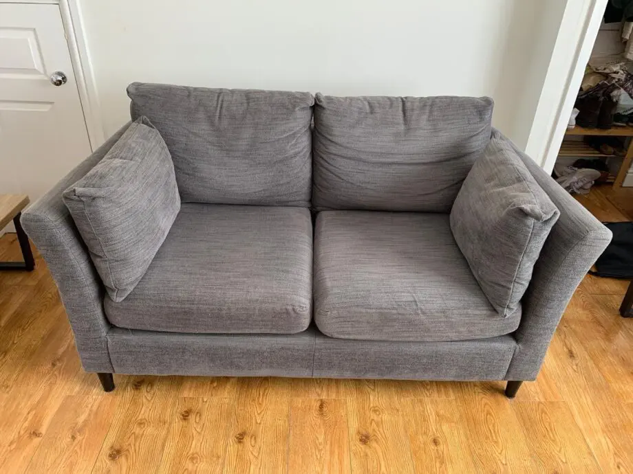 Grey IKEA sofa, armchair, and footstool