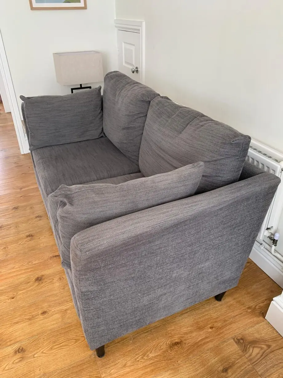 Grey IKEA sofa, armchair, and footstool