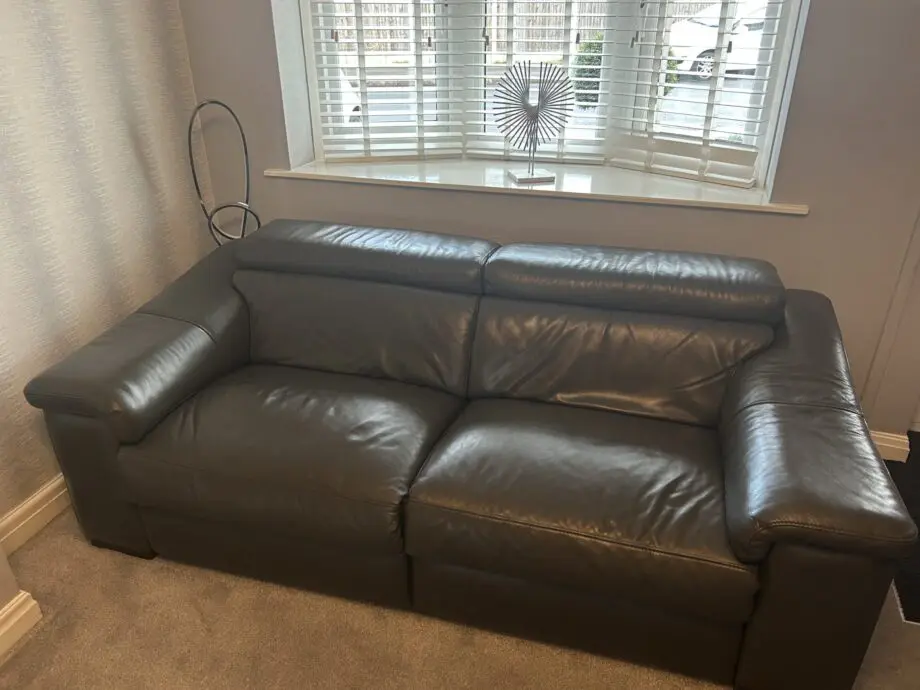 2 grey leather recliner sofas