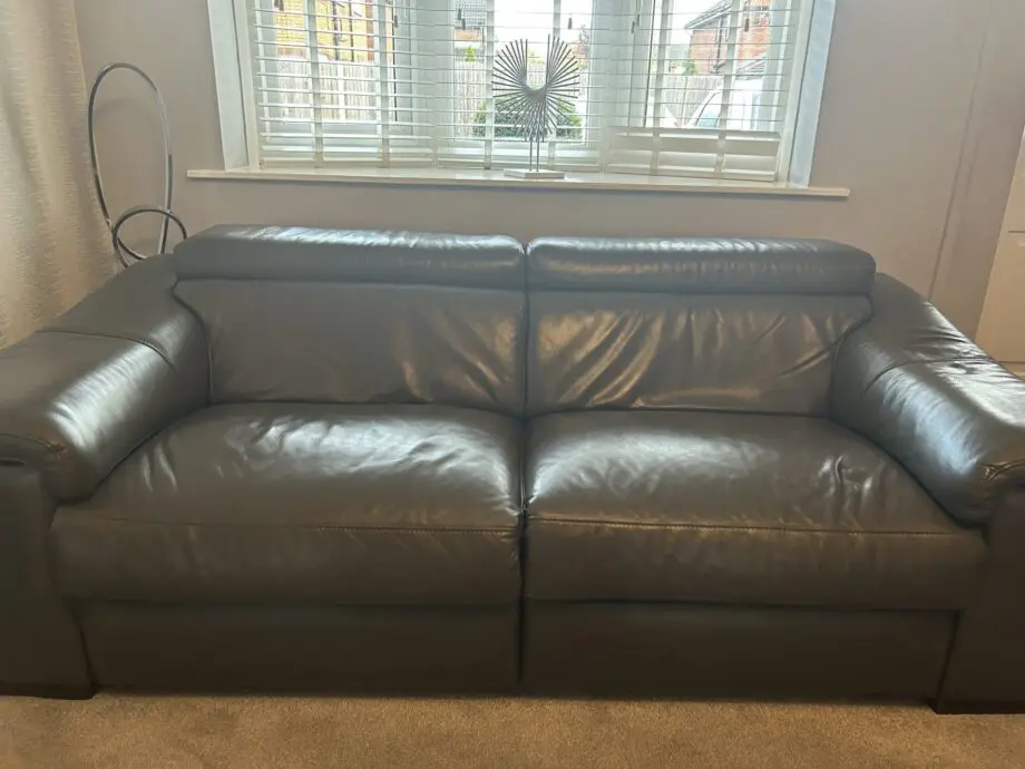 2 grey leather recliner sofas