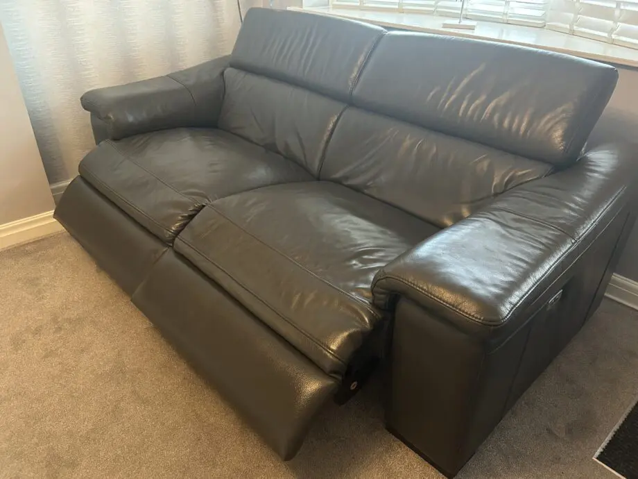 2 grey leather recliner sofas