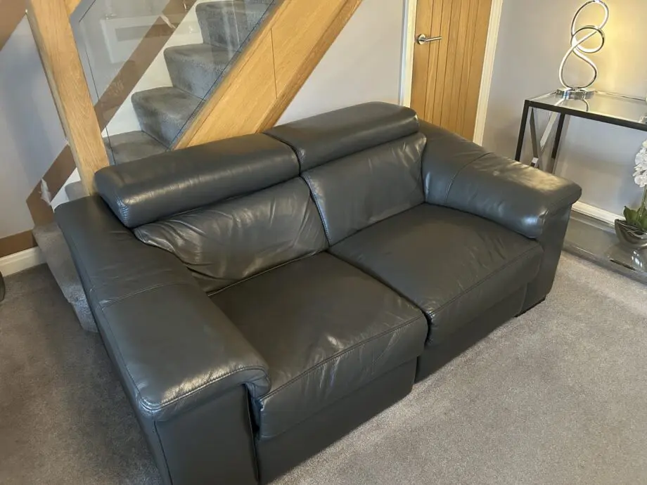 2 grey leather recliner sofas
