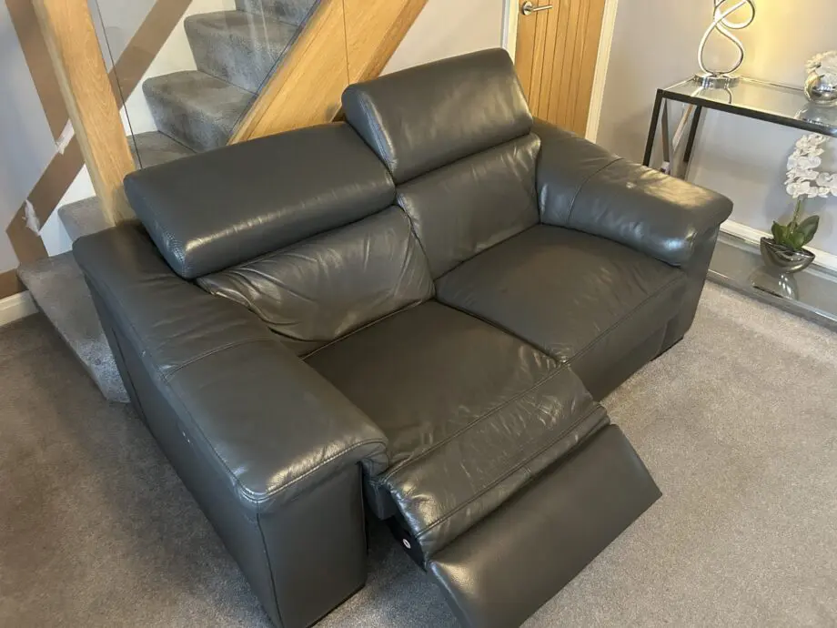 2 grey leather recliner sofas