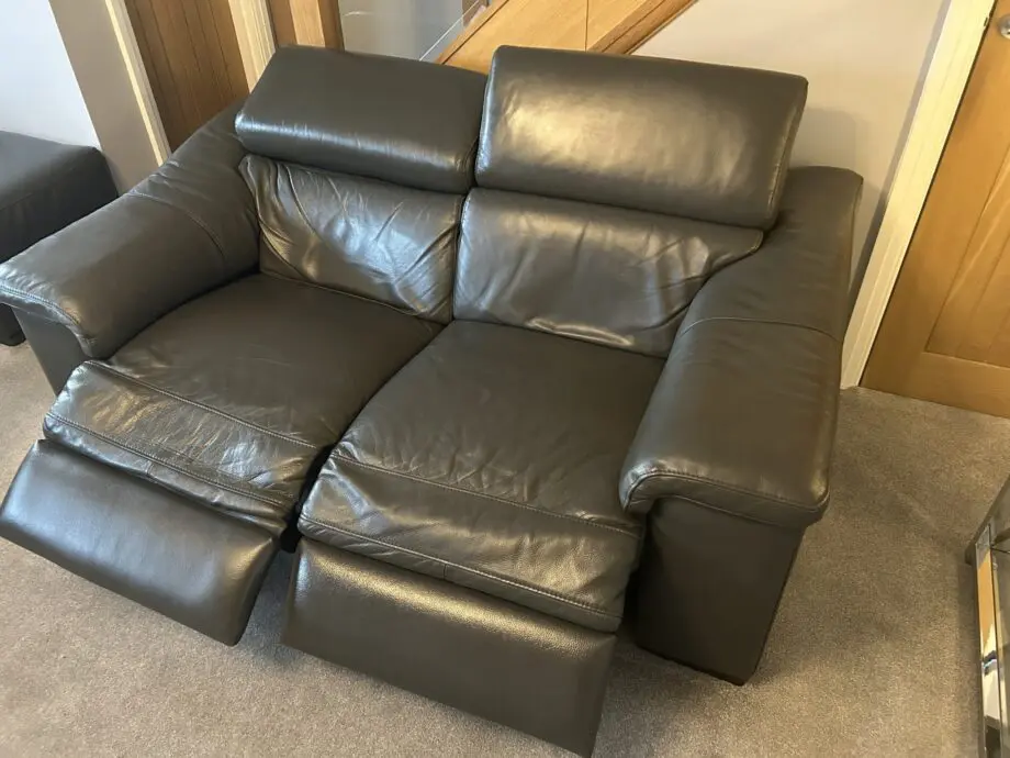 2 grey leather recliner sofas