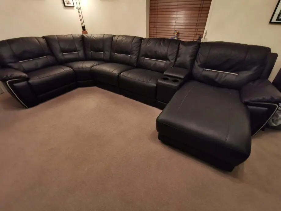 Harvey's black corner chaise long with recliner