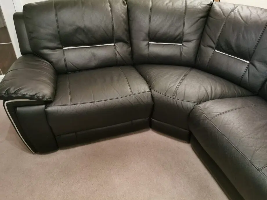 Harvey's black corner chaise long with recliner