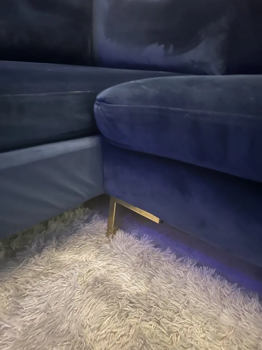 Blue velvet chaise corner sofa with ottoman