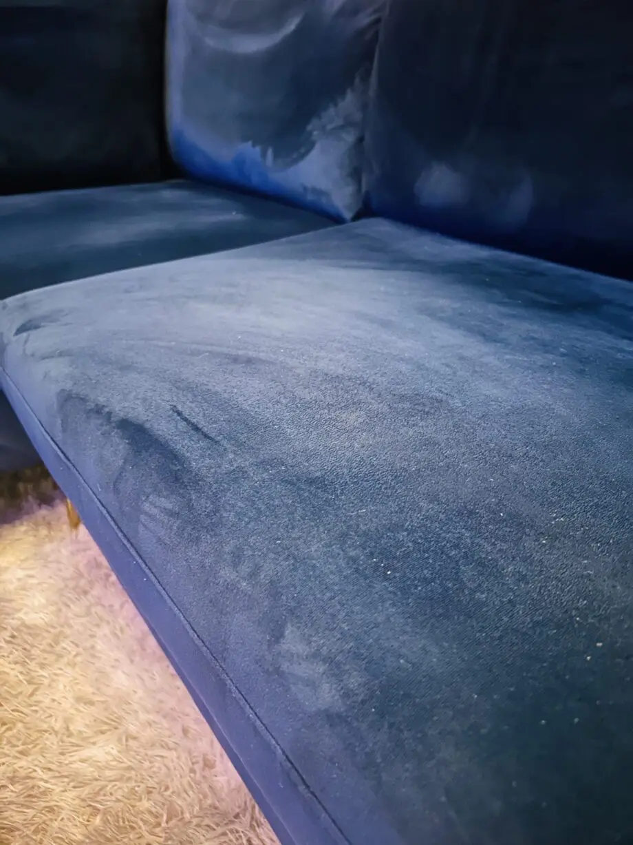 Blue velvet chaise corner sofa with ottoman
