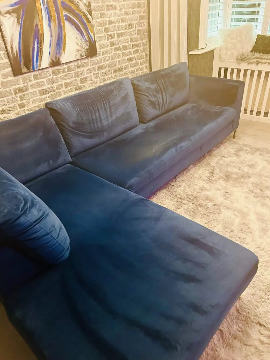Blue velvet chaise corner sofa with ottoman
