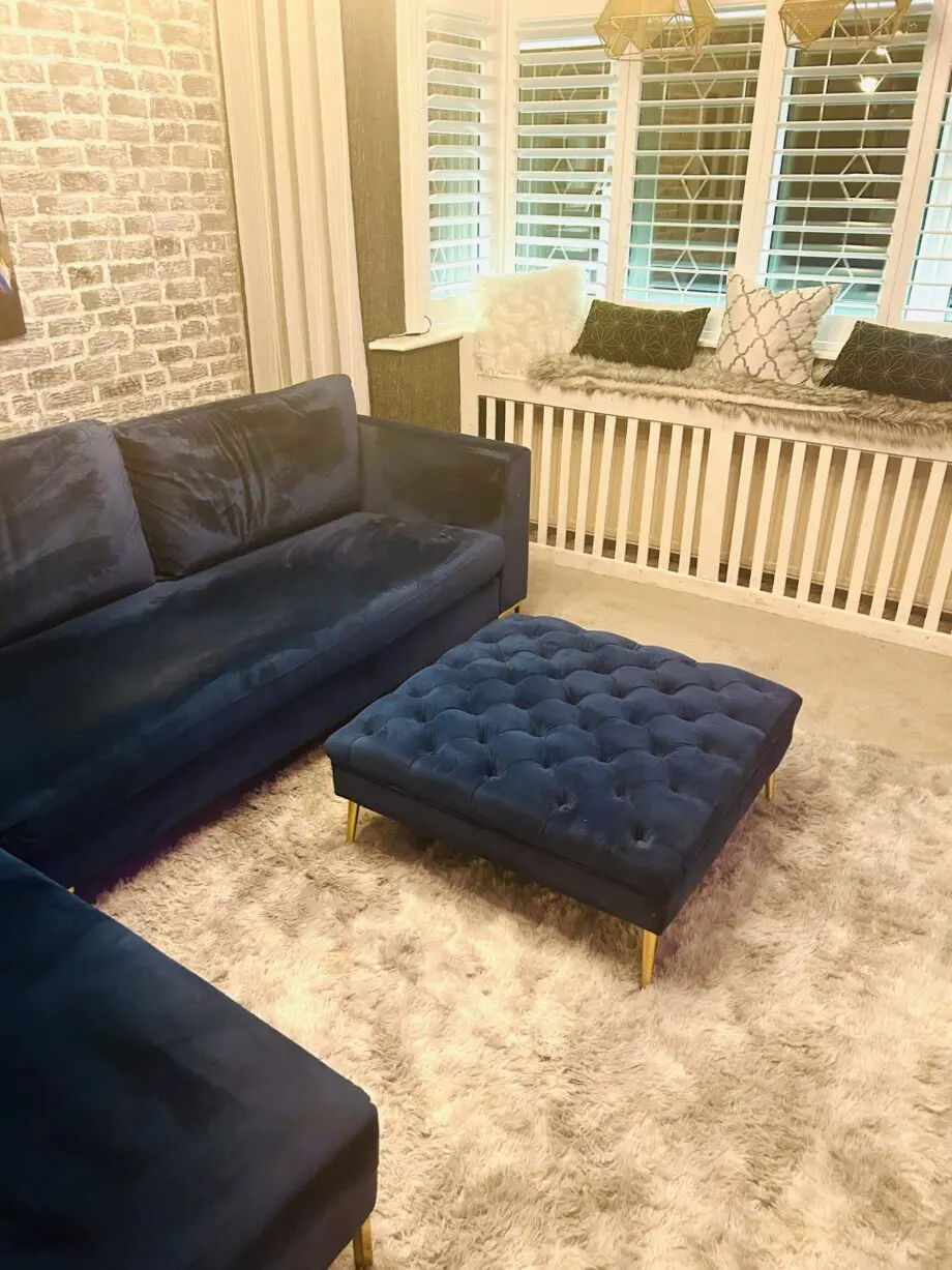 Blue velvet chaise corner sofa with ottoman