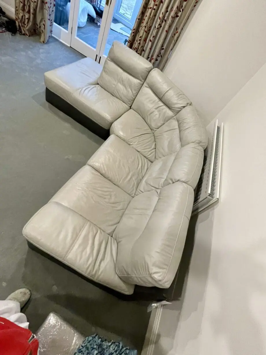 L shaped grey & dark brown leather sofa