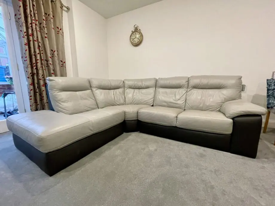 L shaped grey & dark brown leather sofa