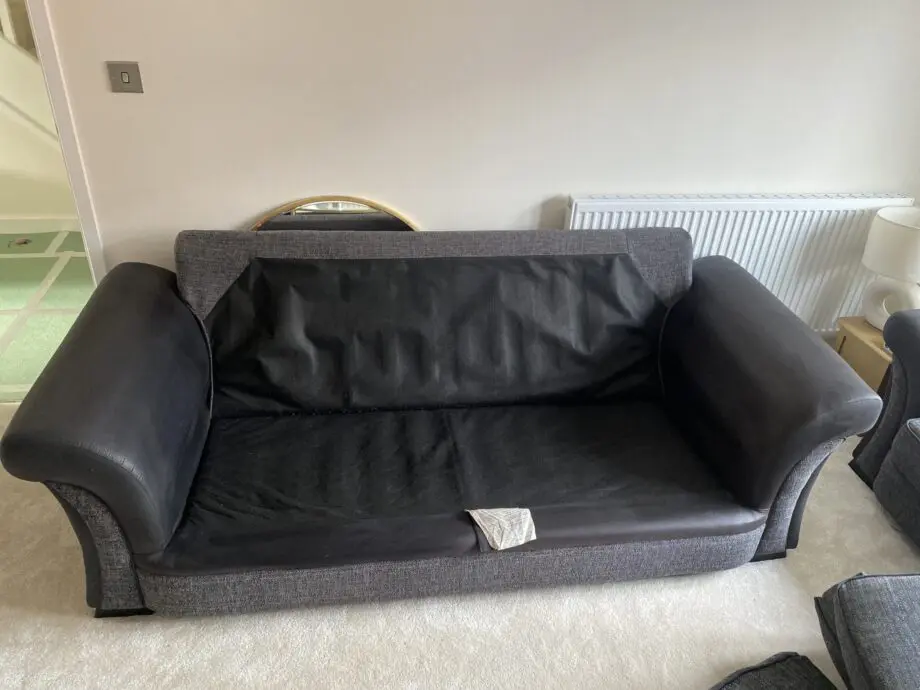 SCS grey 3 seater sofa with black leather arms