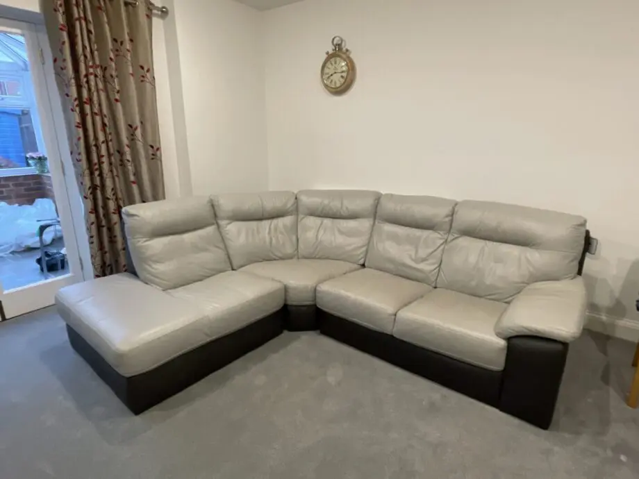 L shaped grey & dark brown leather sofa