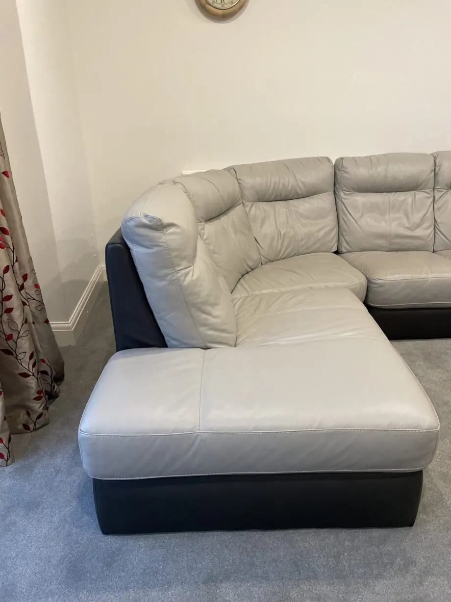 L shaped grey & dark brown leather sofa